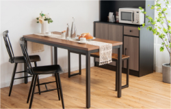 The dining room contains a dining table and chair set, as well as kitchen cabinets.