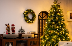 Living room decorated for Christmas with a lit Christmas tre